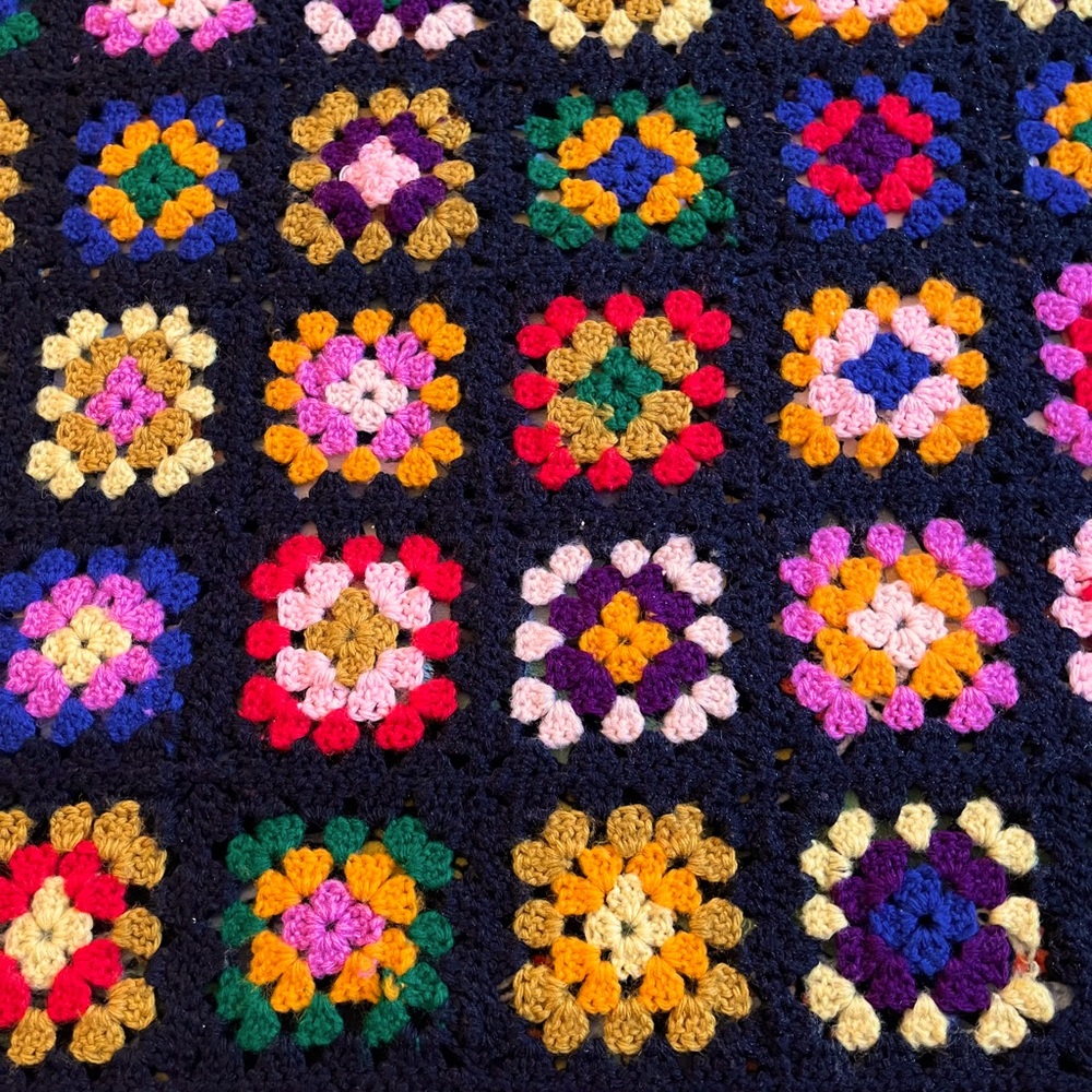 GORGEOUS granny square crocheted blanket.